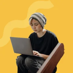 Girl-with-laptop-yellow-bg